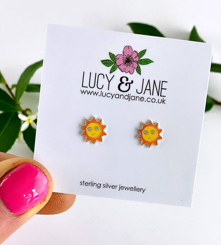 sterling silver sun studs in yellow and orrange with a cheery face