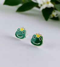 Load image into Gallery viewer, fun sterling silver frog studs.  The earrings are green frog heads that are wearing a tiny yellow crown 