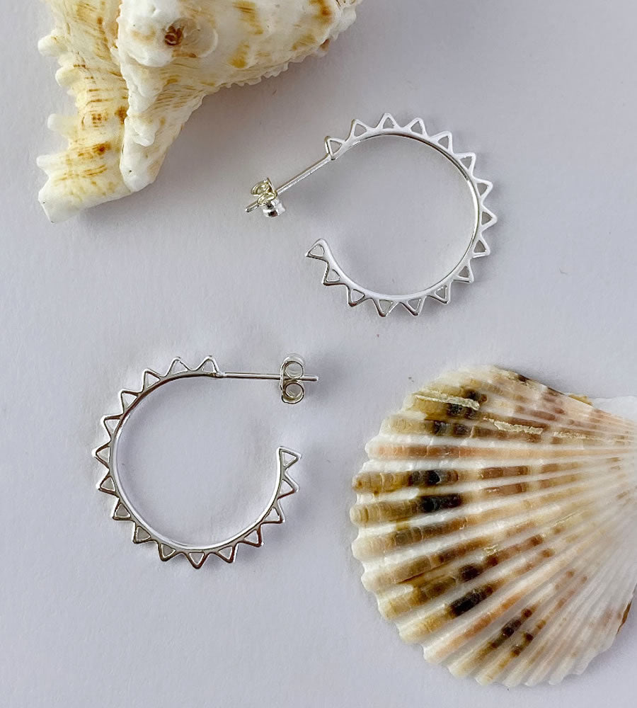 medium sized sterling siiver sun hoops with a stud back