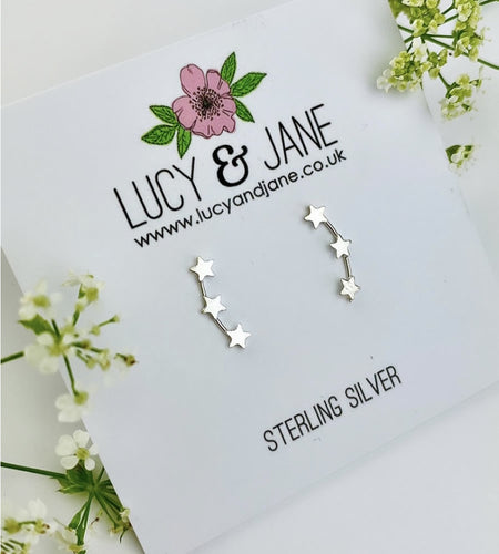 sterling silver stars climber earring.  Pair of earrings that feature small stars on a curved bar.