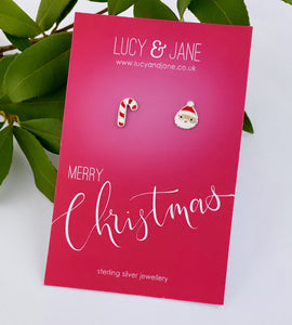 Fun sterling silver mismatched ear studs with one Santa and one candy cane earring