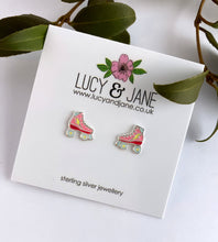 Load image into Gallery viewer, fun and colourful ear studs in the shape of roller stakes.  Colours inlcude pink and red with a yellow lightning bolt.  Photo shows the roller skate earrings on a Lucy and Jane backing card