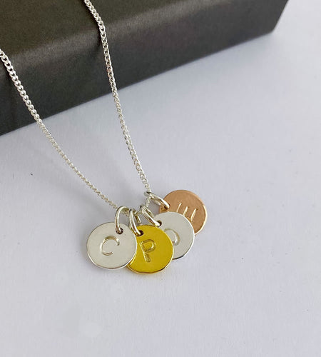 sterling silver, gold and rose gold four letter personalised necklace