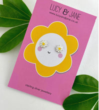 Load image into Gallery viewer, sterling silver daisy studs in white and yellow on a fun colourful card - great earrings for kids