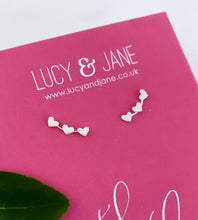 Load image into Gallery viewer, sterling silver heart ear climbers on a pink Lucy and jane earring card