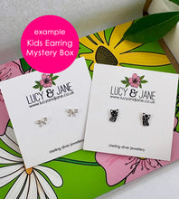Load image into Gallery viewer, Lucy and Jane kids mystery earring boxes - with example showing a par of sterling silver bow studs and a pair of sterling silver black cat studs.  Mystery boxes are perfect for children or as a first pair of earrings for young girls.
