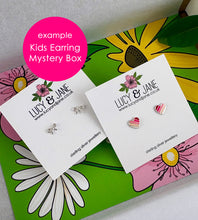 Load image into Gallery viewer, example of the children's earrings you could find the the Lucy and Jane Kids Earring Mystery Box.  Photo shows a pair of sterling silver bow studs and a pair of pink stripe heart stud earrings
