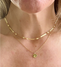 Load image into Gallery viewer, gold herringbone twist necklace on model, styled with a longer gold initial necklace.