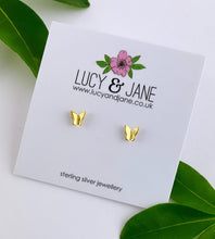 Load image into Gallery viewer, small gold butterfly earrings on a white backing card