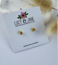 Load image into Gallery viewer, small gold knot stud earrings on a Lucy and Jane backing card