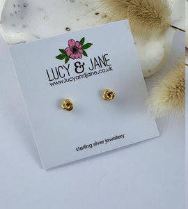 small gold knot stud earrings on a Lucy and Jane backing card