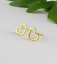 Load image into Gallery viewer, Pair of gold open heart stud earrings with a post and butterfly back.
