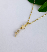 Load image into Gallery viewer, gold shooting star necklace with added sparkles and a gold chain