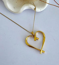 Load image into Gallery viewer, Gold twist heart necklace on a gold chain