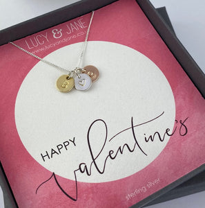 Three initial necklace on a Happy Valentine's backing card