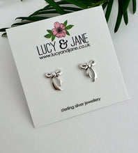 Load image into Gallery viewer, sterling silver bow stud earrings on a Lucy and Jane earring card