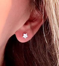 Load image into Gallery viewer, model wearing sterling silver hammered star studs