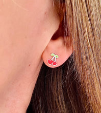 Load image into Gallery viewer, sterling silver red and green cherry heart studs on a model's ear