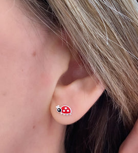 sterling silver ladybird studs in model's ear