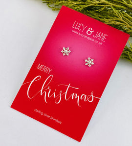 sterling silver snowflake studs on a merry Christmas card