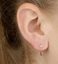 Load image into Gallery viewer, rose gold star pull through earrings on models ear