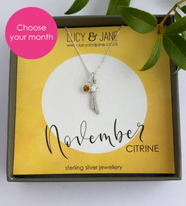 sterling silver birthstone necklace for november with a shooting star pendant