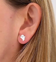Load image into Gallery viewer, A close-up of a person's ear wearing a small white sterling silver ghost stud earring.