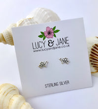 Load image into Gallery viewer, super cute sterling silver small turtle earrings on a lucy and jane earring card