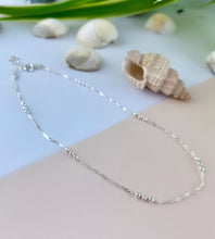 Load image into Gallery viewer, A delicate sterling silver beaded chain anklet with a textured, twisted design, 