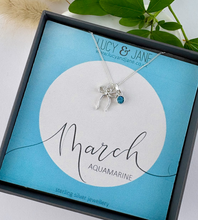 Load image into Gallery viewer, sterling silver bow birthstone necklace for March with an aquamarine stone.  Necklace in a gift box with the Lucy and Jane jewellery branding