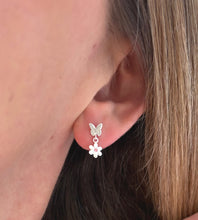 Load image into Gallery viewer, sterling silver butterfly and flower drop earrings in model's ear