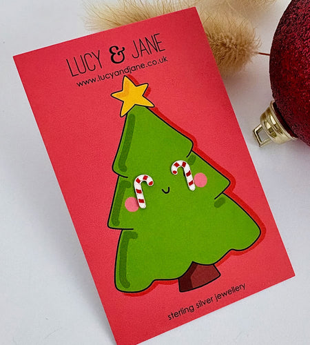 sterling silver red and white striped candy cane earrings on a Christmas tree backing card