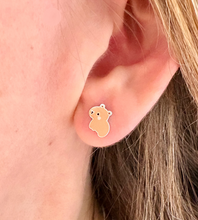 Load image into Gallery viewer, sterling silver capybara earrings for children. Shown in a model's ear