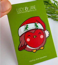 Load image into Gallery viewer, sterling silver christmas dinosaur earrings on a christmas earring card. T-rex Christmas earrings