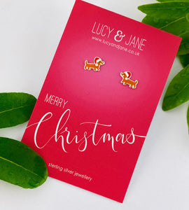 sterling silver Christmas sausage dog studs on a merry Christmas card