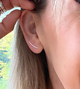 photo of someone wearing the sterling silver curved bar earring
