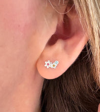 Load image into Gallery viewer, sterling silver flower climber earring in model's ear.  Earring features two flowers and three colourful crystals.