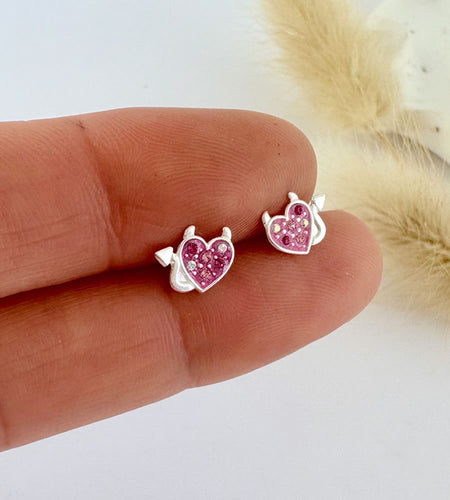 sterling silver sparkly pink heart studs with devil horns and tail to make them the perfect earrings for halloween