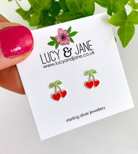 Load image into Gallery viewer, sterling silver cherry heart stud earrings on a lucy and Jane earring card