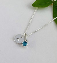 Load image into Gallery viewer, sterling silver initial birhstone necklace for march with a blue aquamarine birthstone and sterling silver disc hand stamped with a letter of your choice