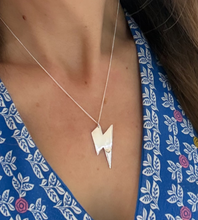 Load image into Gallery viewer, larger sterling silver lightning bolt necklace on model's neck.