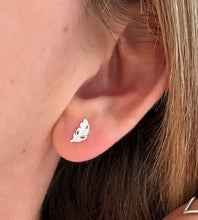 Load image into Gallery viewer, sterling silver feather studs in model's ear