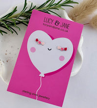 Load image into Gallery viewer, sterling silver pink heart climber ear studs on a valentine's card