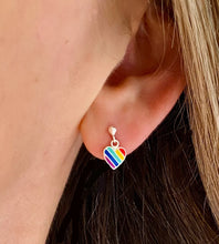 Load image into Gallery viewer, sterling silver pride rainbow heart drop studs on model