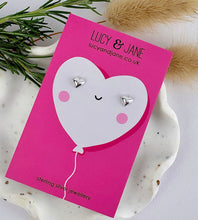 Load image into Gallery viewer, sterling silver small puff heart ear studs on a Valentine card
