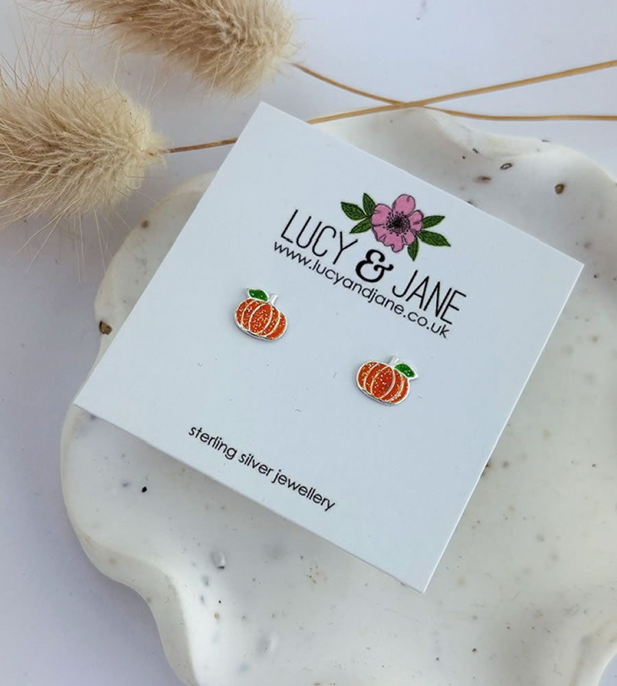 sterling silver pumpkin stud earrings on a Lucy and Jane white card