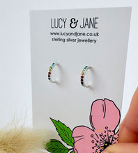 Load image into Gallery viewer, sterling silver rainbow huggie hoops with colourful crystals