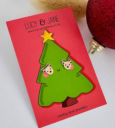 sterling silver reindeer head studs with a sparkly red nose on a Christmas card