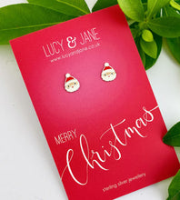 Load image into Gallery viewer, sterling silver santa studs for children on a merry Christmas card