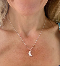 Load image into Gallery viewer, sterling silver hammered crescent moon necklace on a model's neck